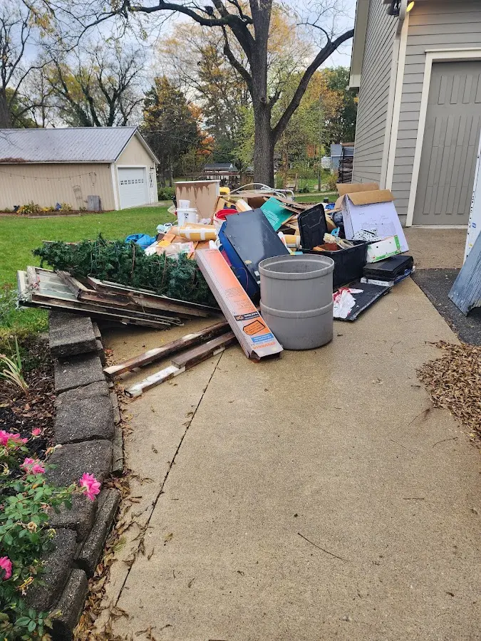 Dumpster being loaded with debris for Commercial Dumpster Rental in Acworth